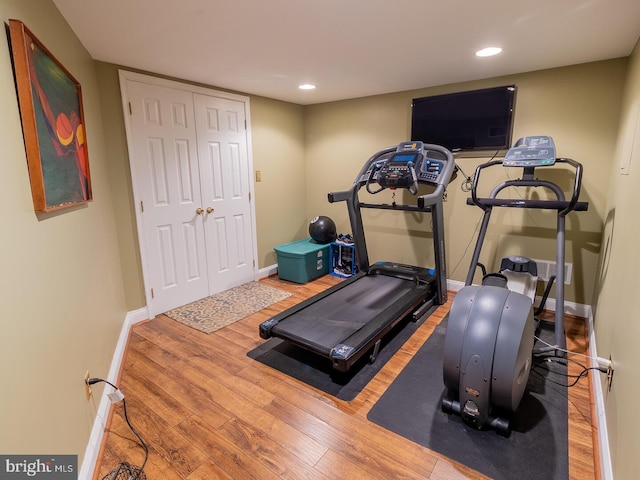 exercise area featuring wood-type flooring