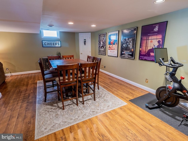 dining space with hardwood / wood-style flooring