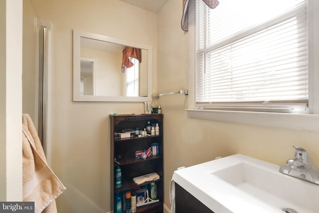 bathroom with a wealth of natural light and vanity