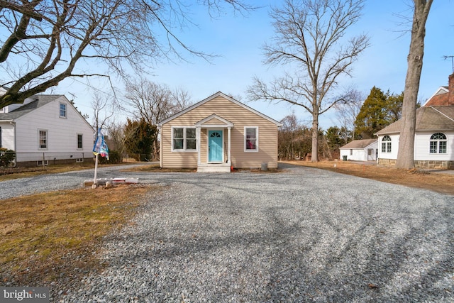 bungalow-style home with driveway