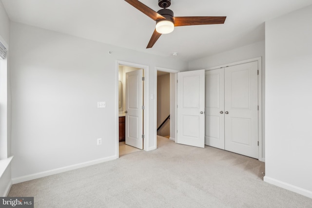 unfurnished bedroom with light carpet, a closet, and ceiling fan