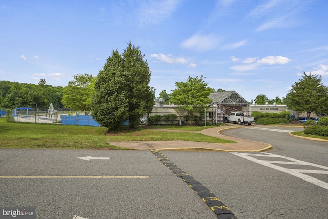 view of road featuring a yard