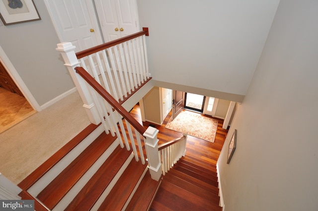 stairway featuring hardwood / wood-style floors