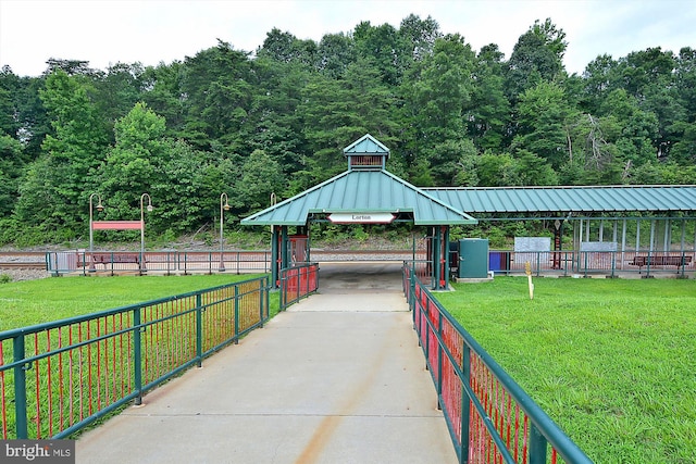 view of home's community with a yard