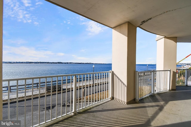 balcony featuring a water view