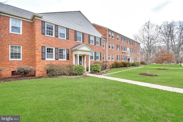 view of property featuring a front yard