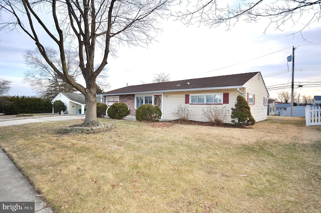 ranch-style house with a front yard