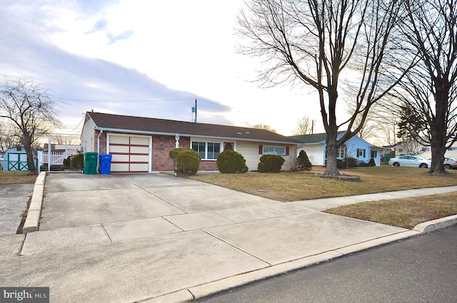 single story home featuring a garage and a front yard