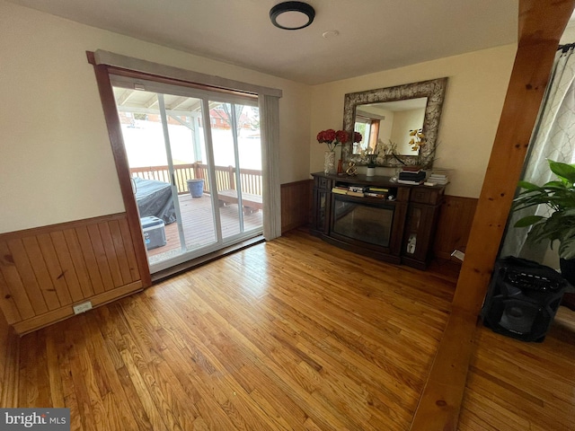 interior space with a fireplace and light hardwood / wood-style flooring