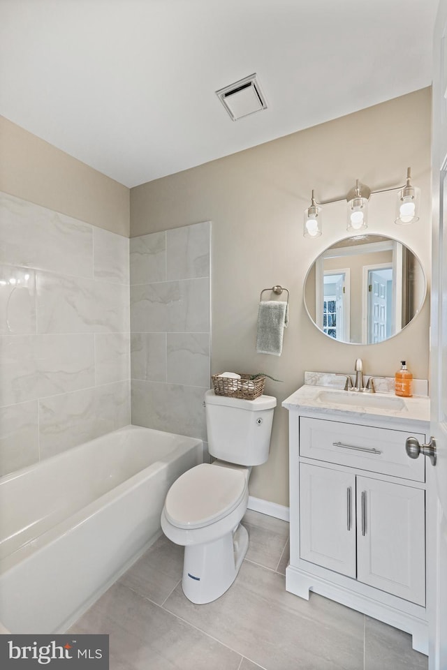 full bathroom with tiled shower / bath combo, tile patterned floors, vanity, and toilet