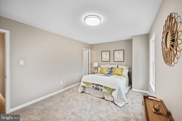 carpeted bedroom with multiple windows