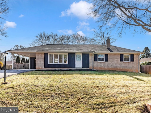 ranch-style home with a carport and a front yard