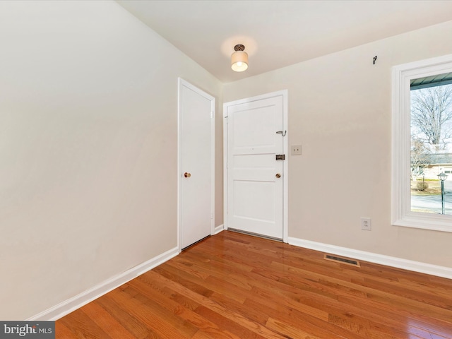 foyer entrance with wood-type flooring