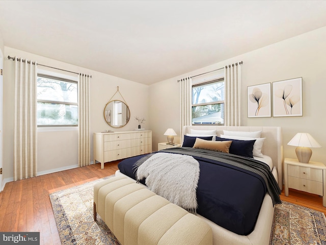 bedroom with hardwood / wood-style flooring