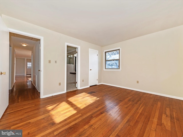 spare room featuring wood-type flooring