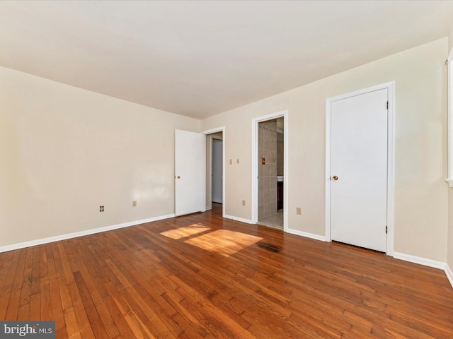 unfurnished room featuring wood-type flooring