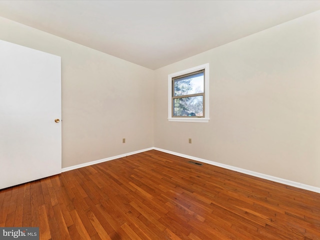 empty room featuring hardwood / wood-style floors