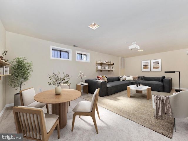 dining area with light colored carpet