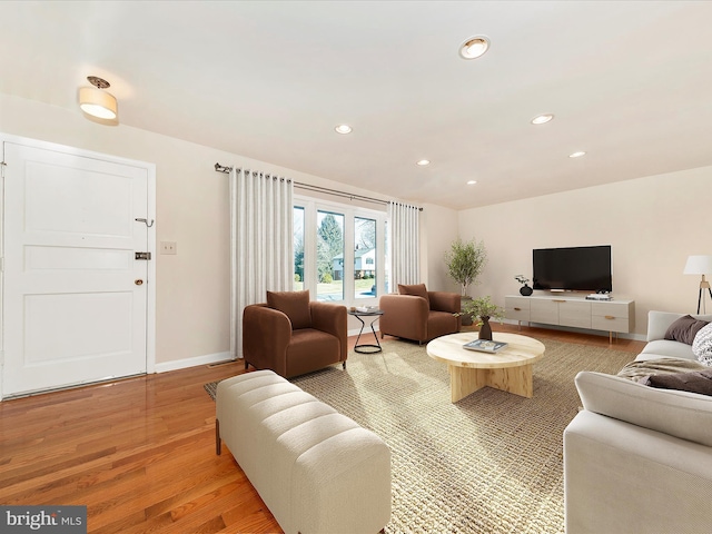 living room with light hardwood / wood-style flooring