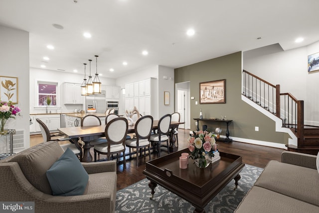 living room featuring stairway, wood finished floors, and recessed lighting