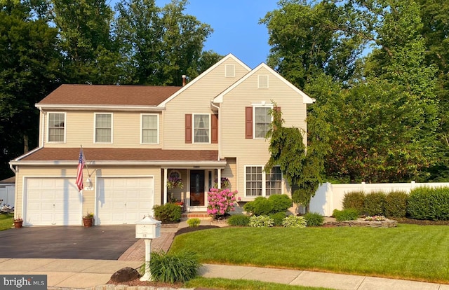 front of property featuring a garage and a front yard