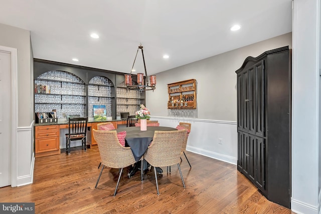 dining room featuring dark wood-type flooring and recessed lighting