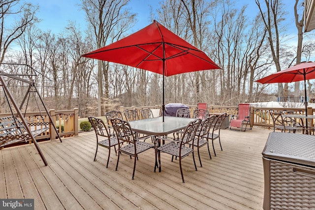 wooden deck with outdoor dining area