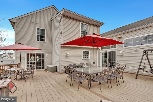 wooden deck featuring outdoor dining space