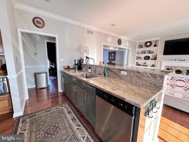 kitchen with visible vents, light stone counters, open floor plan, stainless steel dishwasher, and a sink