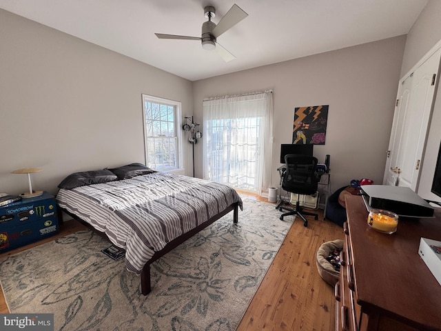 bedroom with a ceiling fan and light wood finished floors