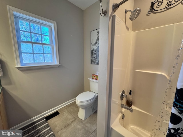 bathroom with toilet, shower / tub combo, tile patterned flooring, and baseboards