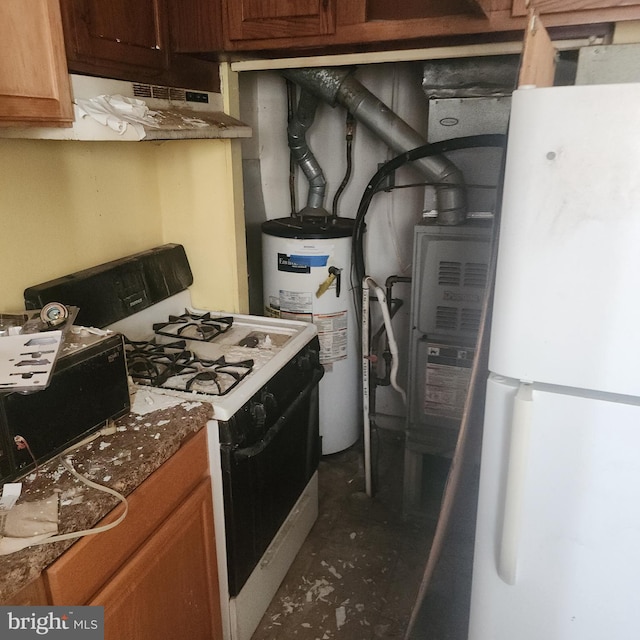 kitchen with water heater, gas range, and white fridge