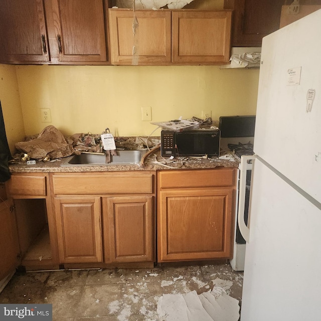 kitchen with white fridge and sink