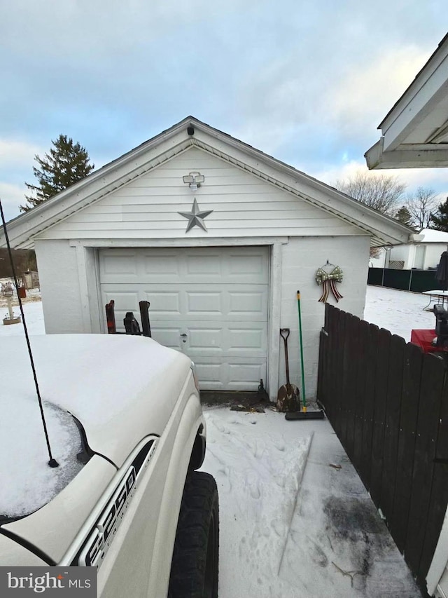 view of snow covered garage