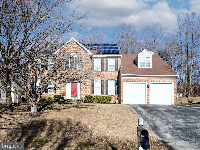 view of front of house featuring solar panels