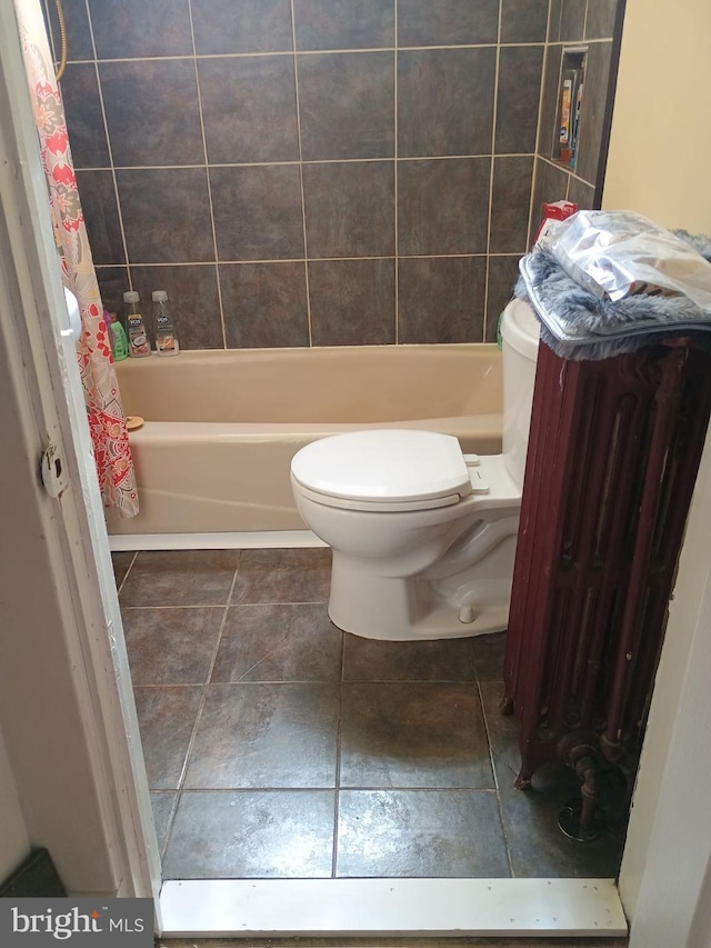 bathroom with tile patterned flooring and toilet