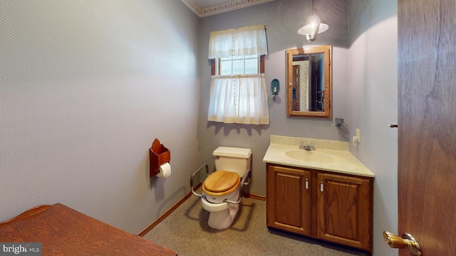 bathroom featuring vanity and toilet