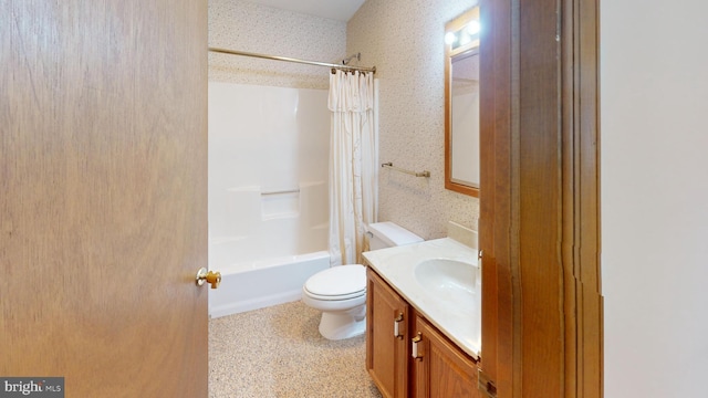 full bathroom featuring vanity, shower / bath combo, and toilet