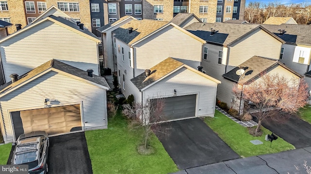 exterior space with a garage and a front yard