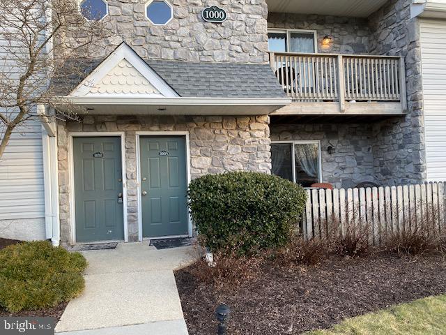 entrance to property with a balcony