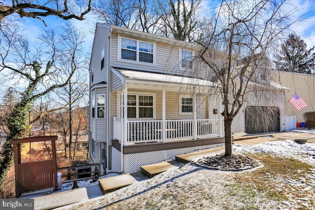 front facade with a garage and covered porch