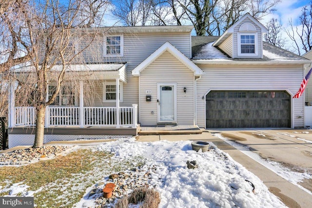 view of front of home with a garage and covered porch