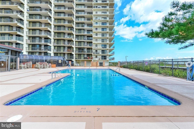 view of pool featuring a patio area