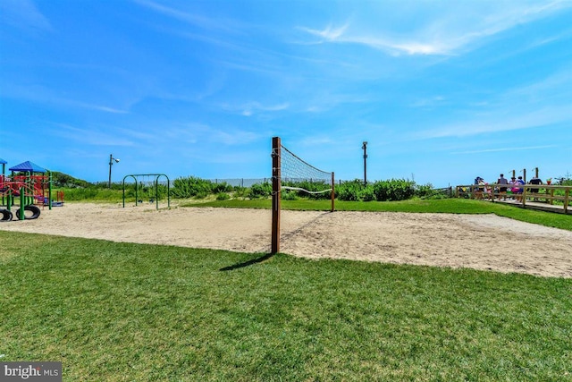 view of property's community with a playground and a lawn