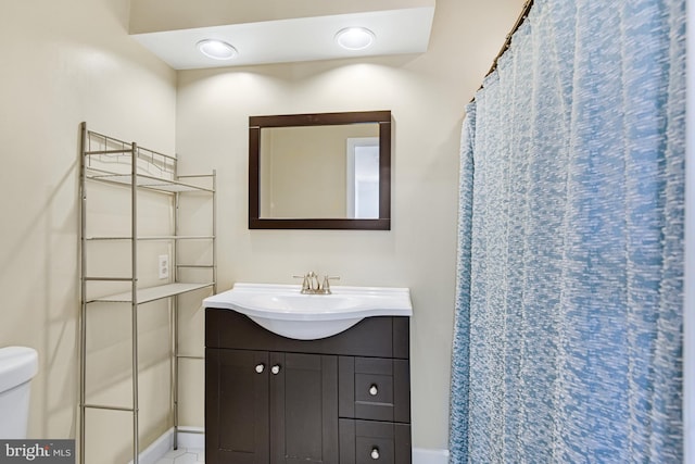 bathroom featuring vanity and toilet