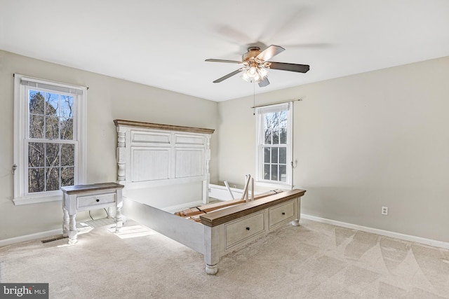 bedroom featuring ceiling fan and light colored carpet