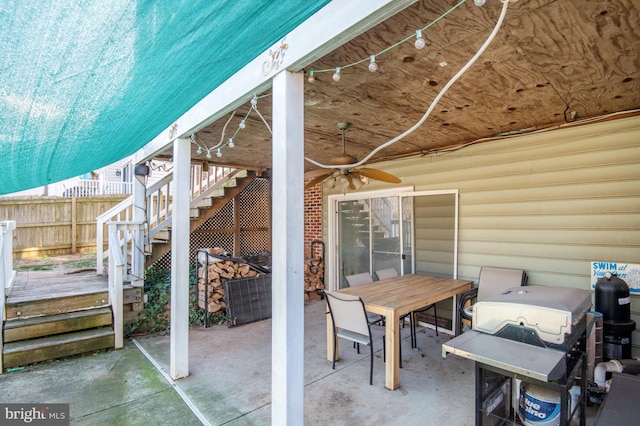 view of patio with area for grilling and ceiling fan