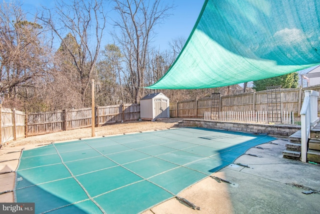 view of swimming pool featuring a shed