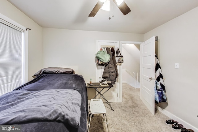 carpeted bedroom with ceiling fan