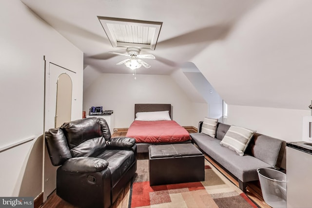 bedroom with vaulted ceiling with skylight and ceiling fan